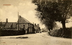 The Street looking west from the corner with Bircham Road and with distant figures. Postcard, c 1920. Loaned JW