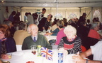 Queen's Golden Jubilee 2002: party in a marquee on the playing field, Ken and Joan Foskett in foreground