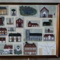 Embroidered picture of Stanhoe buildings by Eva Blackburn.