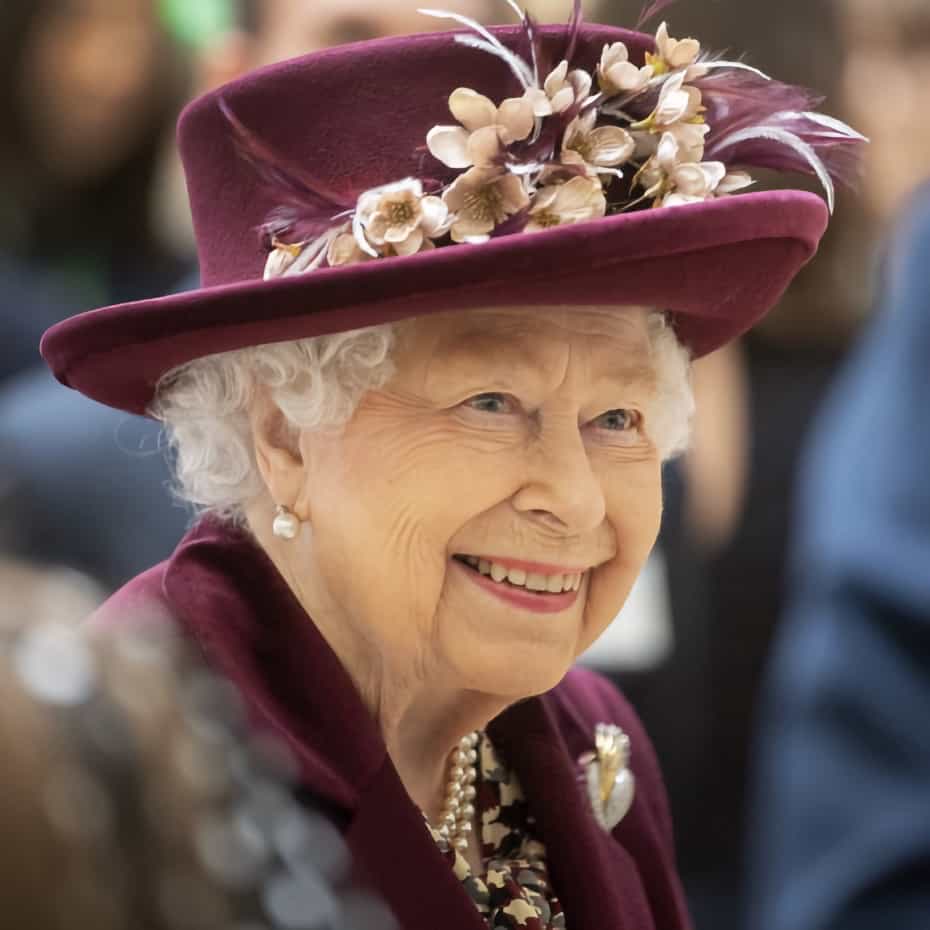 HM Queen Elizabeth II in a purple coat and hat